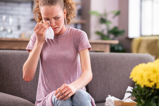 istock Crying unfortunate girl wiping teardrops from eye corners 1136200278