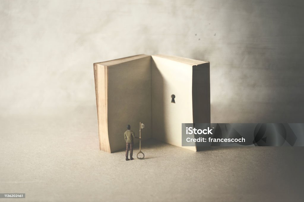 key in a book, surreal concept Book Stock Photo
