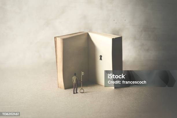 Key In A Book Surreal Concept Stock Photo - Download Image Now - Book, Philosophy, Privacy