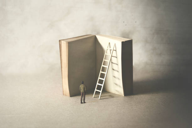istock man reaching higher knowledge level, climbing a book, surreal concept 1136202487