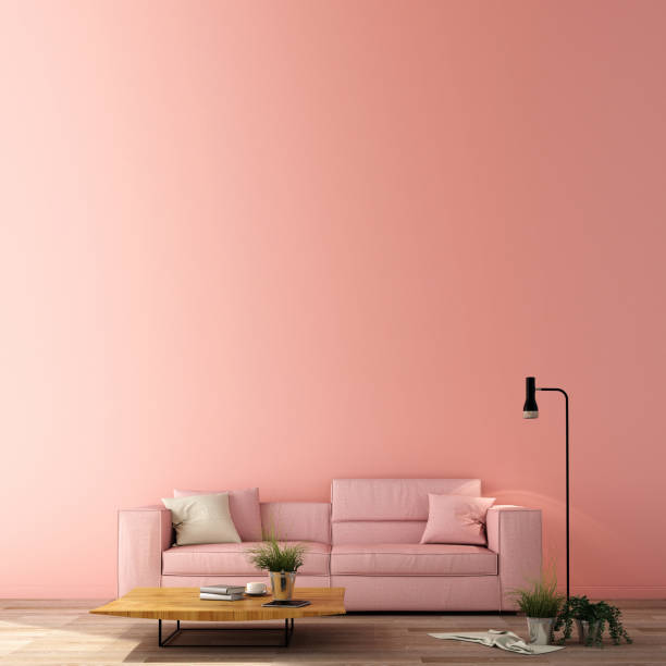 istock 3d illustration,interior design for living area or reception in modern style with sofa, side table,plant on wood floor and light pink wall 1136203054