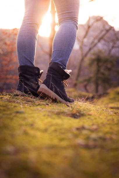 istock Boots of a young woman, timberland 1136203698
