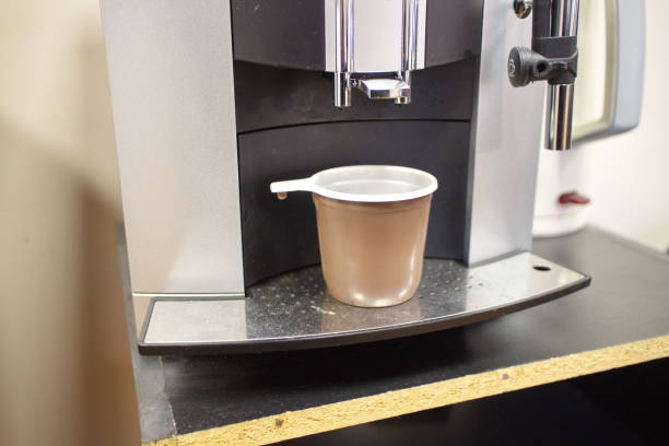 istock coffee machine close up and glass 1136210776