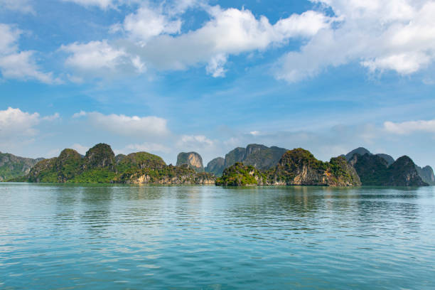Beautiful scenery with limestone islands raising in the ocean at Halong Bay in Vietnam.