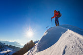 Ski mountaineer enjoy the Sun at Summit - Alps