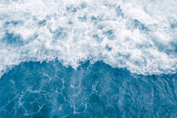 istock Pale blue sea wave during high summer tide, abstract ocean background 1136212315