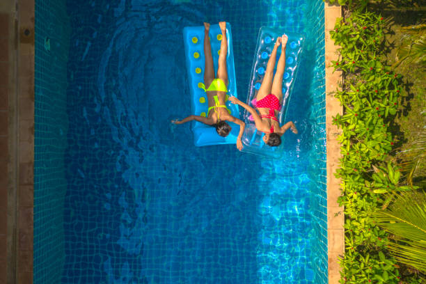 istock two ladies onswimming pool Inflatable mattress float 1136213352