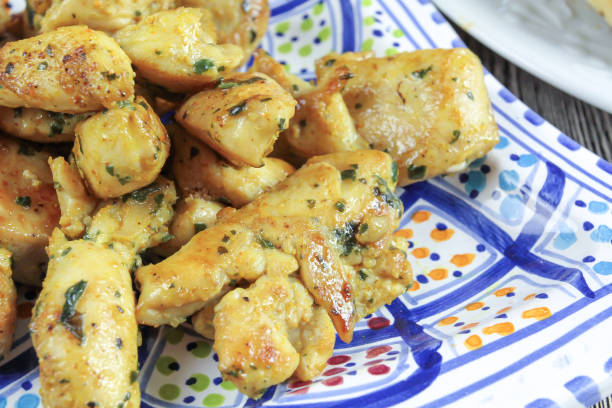 istock Pieces of chicken and naan bread 1136214268