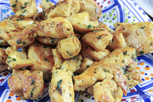 istock Pieces of chicken and naan bread 1136214341