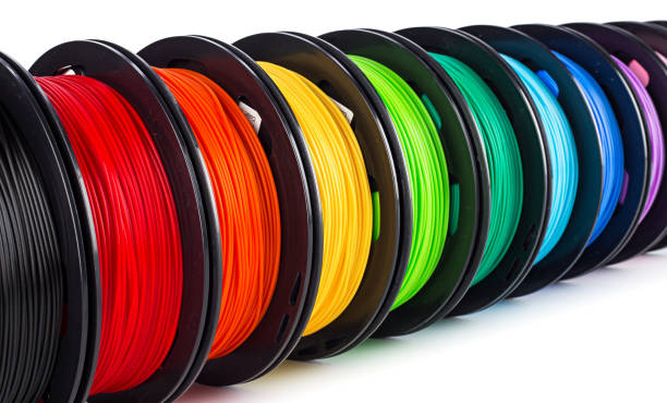 colorful bright wide panorama row of spool 3d printer filament stock photo