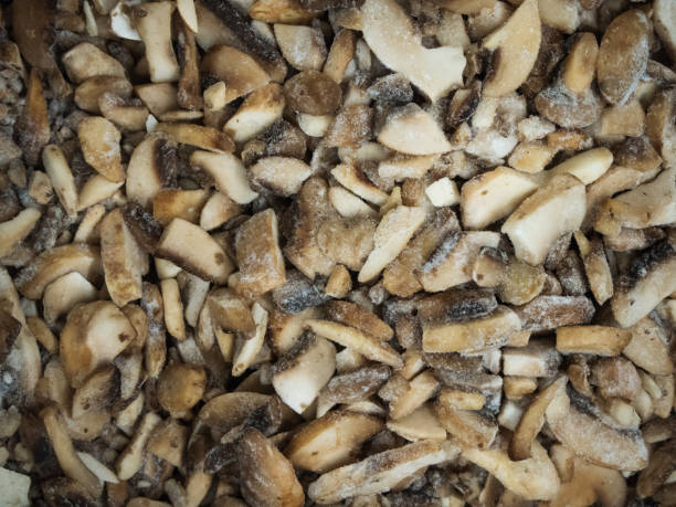 istock Frozen mushrooms in the refrigerator in the store 1136222172