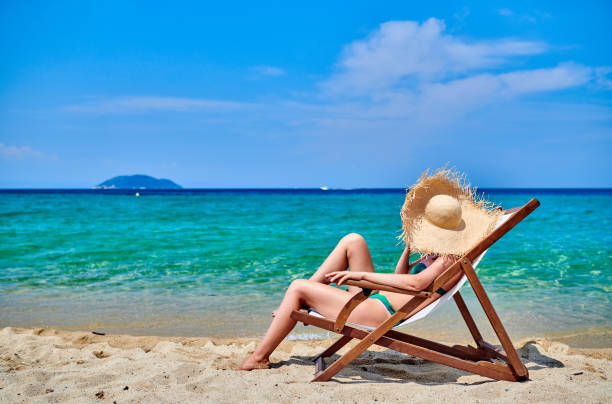 istock Woman in bikini on beach 1136225284