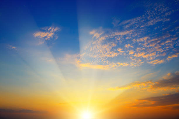 istock Scenic sunset with sun rays against bright blue sky 1136229039