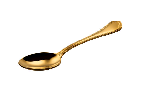 istock Golden spoon isolated on white background 1136230616