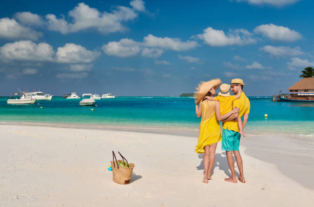 istock Family with three year old boy on beach 1136231291