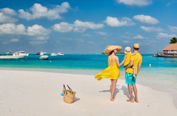 istock Family with three year old boy on beach 1136231295