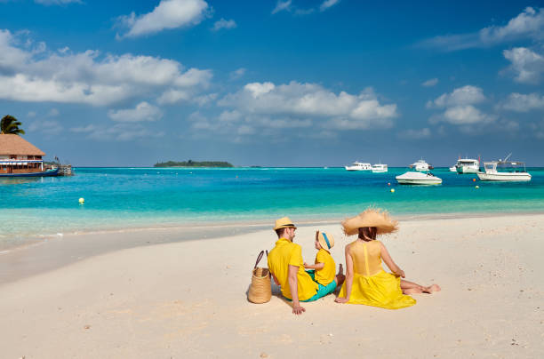 istock Family with three year old boy on beach 1136231296