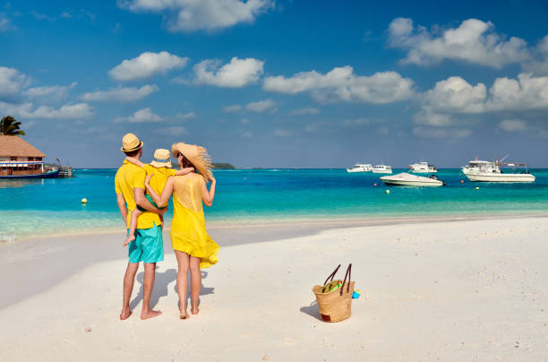 istock Family with three year old boy on beach 1136231297