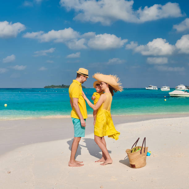 istock Family with three year old boy on beach 1136231301