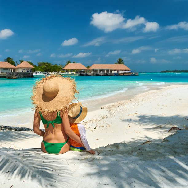 istock Toddler boy on beach with mother 1136231320