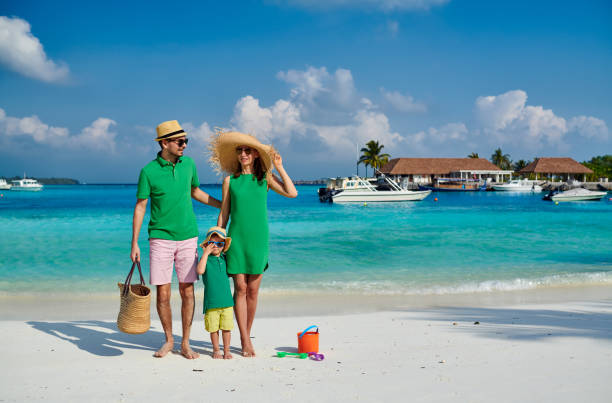Family with three year old boy on beach