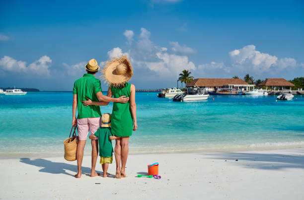 istock Family with three year old boy on beach 1136231328