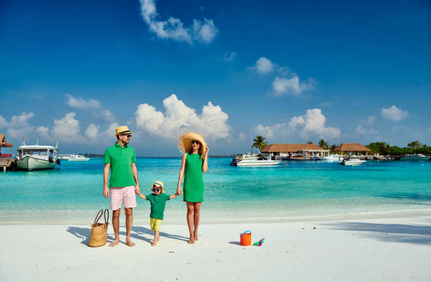 istock Family with three year old boy on beach 1136231353