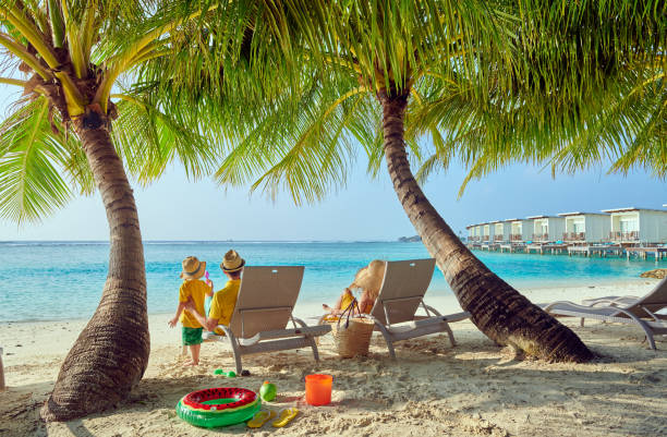istock Family with three year old boy on beach 1136231682