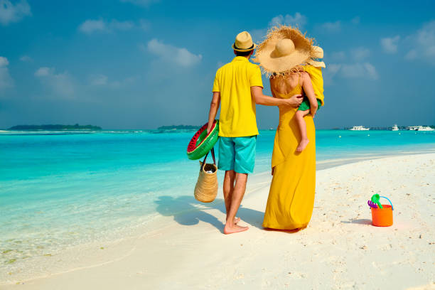 istock Family with three year old boy on beach 1136231707