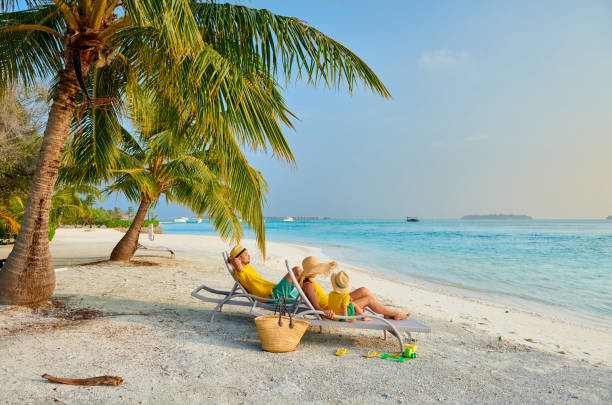 istock Family with three year old boy on beach 1136231723
