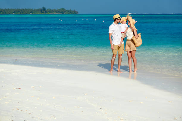istock Family with three year old boy on beach 1136232677