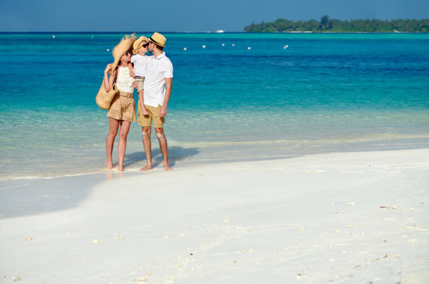 istock Family with three year old boy on beach 1136232685