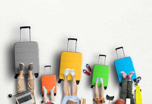 istock Family is going on a trip, five colored suitcases with clothes 1136232861