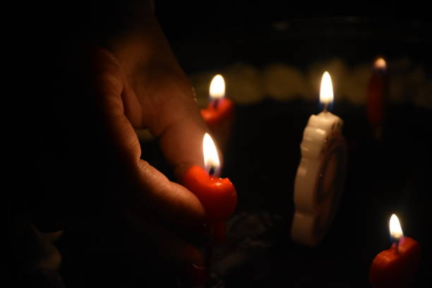 istock Candles on a birthday cake 1136233979