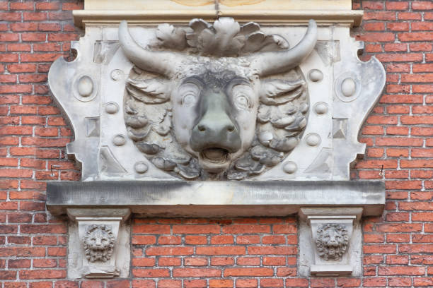 istock Bull head bas-relief sculpture decoration on a wall 1136238033