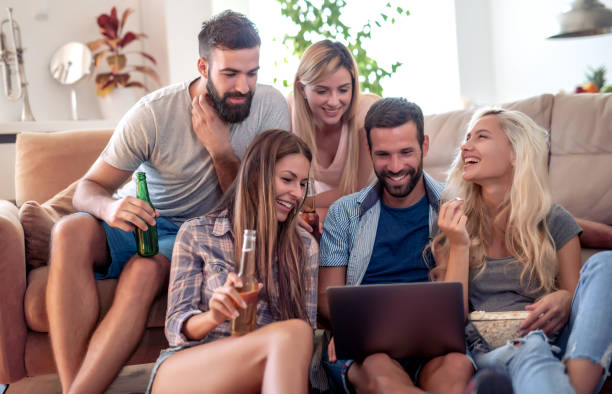 istock Cheerful friends enjoying together at home 1136239928