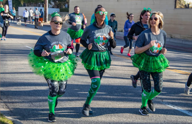 Women Jogging In In St Patricks Day Run Wearing Green Tutu Skirts And  Official Teeshirts And Other Green Accessories Stock Photo - Download Image  Now - iStock
