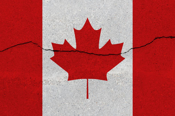 istock Canada flag on concrete wall with crack 1136241688
