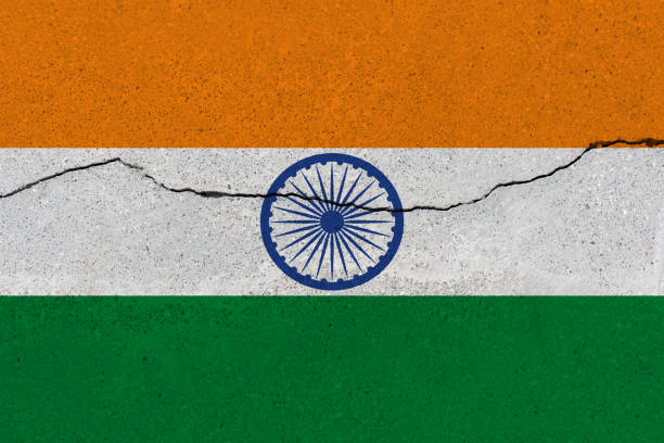 istock India flag on concrete wall with crack 1136241731