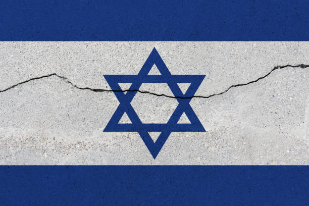 istock Israel flag on concrete wall with crack 1136241734