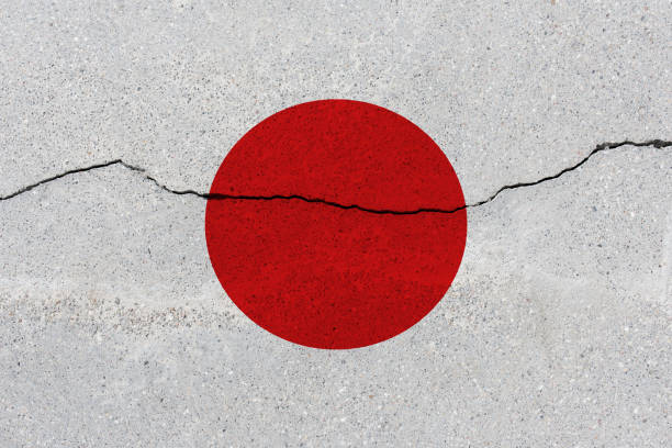 istock Japan flag on concrete wall with crack 1136241742