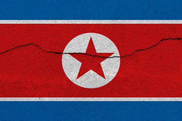 istock North Korea flag on concrete wall with crack 1136241780