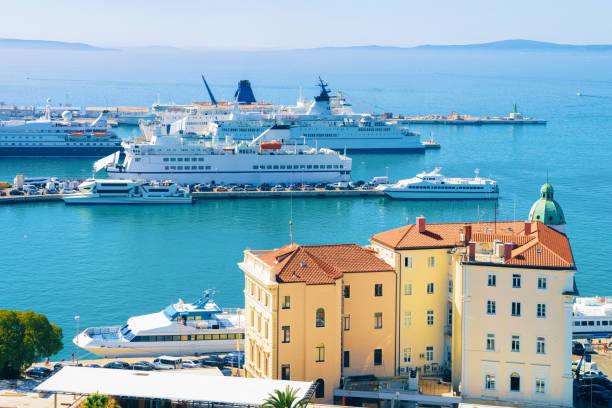 Cruise ships at Old city of Split on Adriatic Coast in Dalmatia in Croatia. Yacht at Roman Town architecture at Croatian Dalmatian Bay. Europe tourism and vacation in summer. Landscape and cityscape.