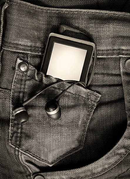 Metaphor about new jeans generation with mp3 player stock photo