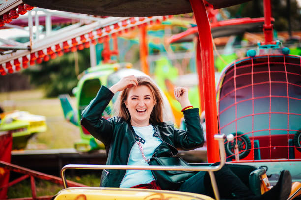 istock Woman Feeling Alive At Amusement Park 1136249857