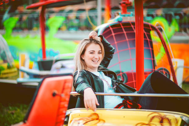 istock Woman Feeling Alive At Amusement Park 1136250583
