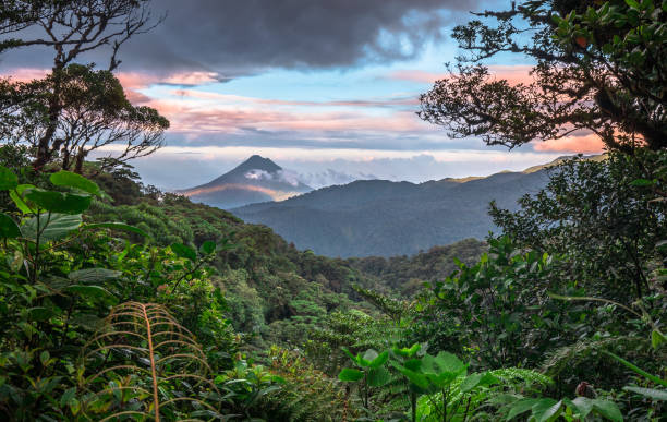 Arenal Volcano, Costa Rica Volcan Arenal dominates the landscape during sunset, as seen from the Monteverde area, Costa Rica. costa rica photos stock pictures, royalty-free photos & images