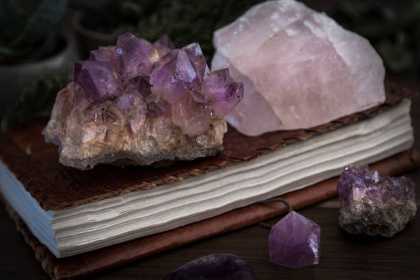 istock Closed Notebook or Journal with Amethyst and Rose Quartz Crystals on top 1136256153