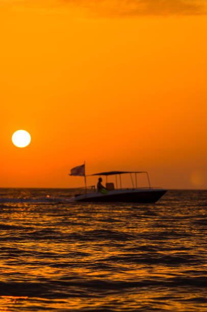 istock Amazing sea sunset on the pebble beach, the sun, waves, clouds 1136256243