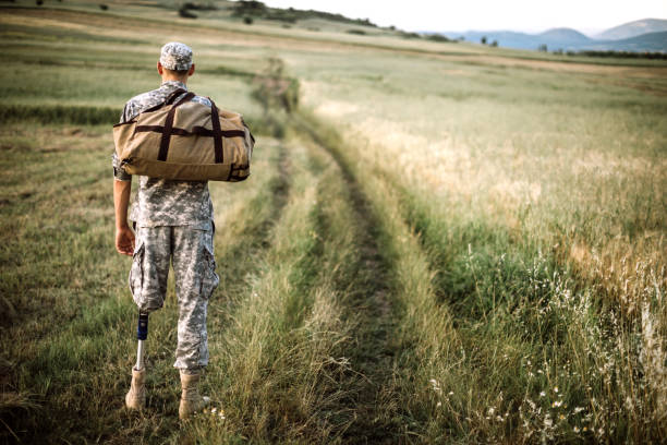 istock Young Amputee Soldier Coming Home  From Serving Military 1136258146